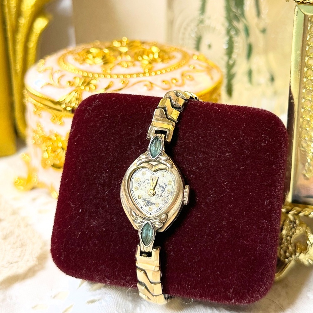 Elegant Gold and Emerald Colored Watch